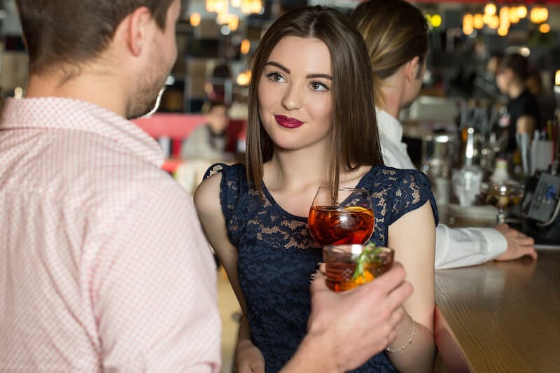 Woman interested in a man at the bar