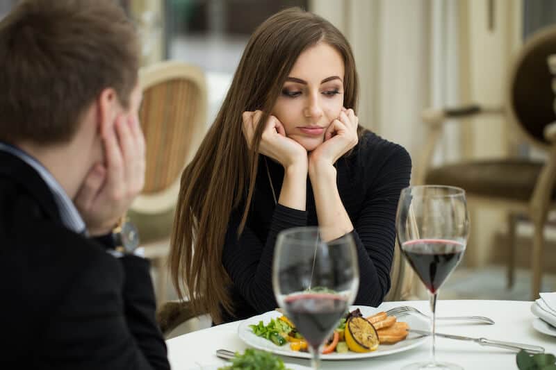 Women bored at a lunch date